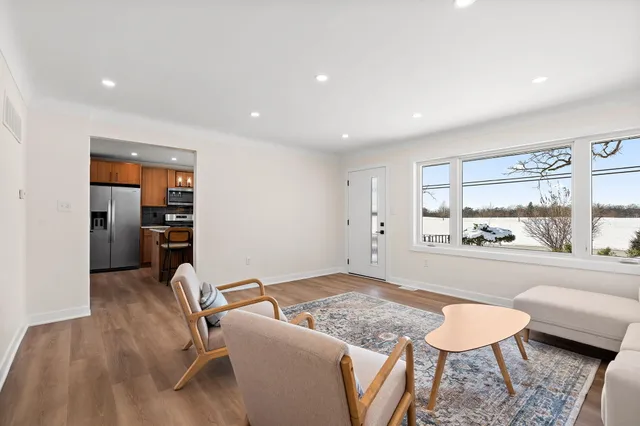 a living room with furniture and a table