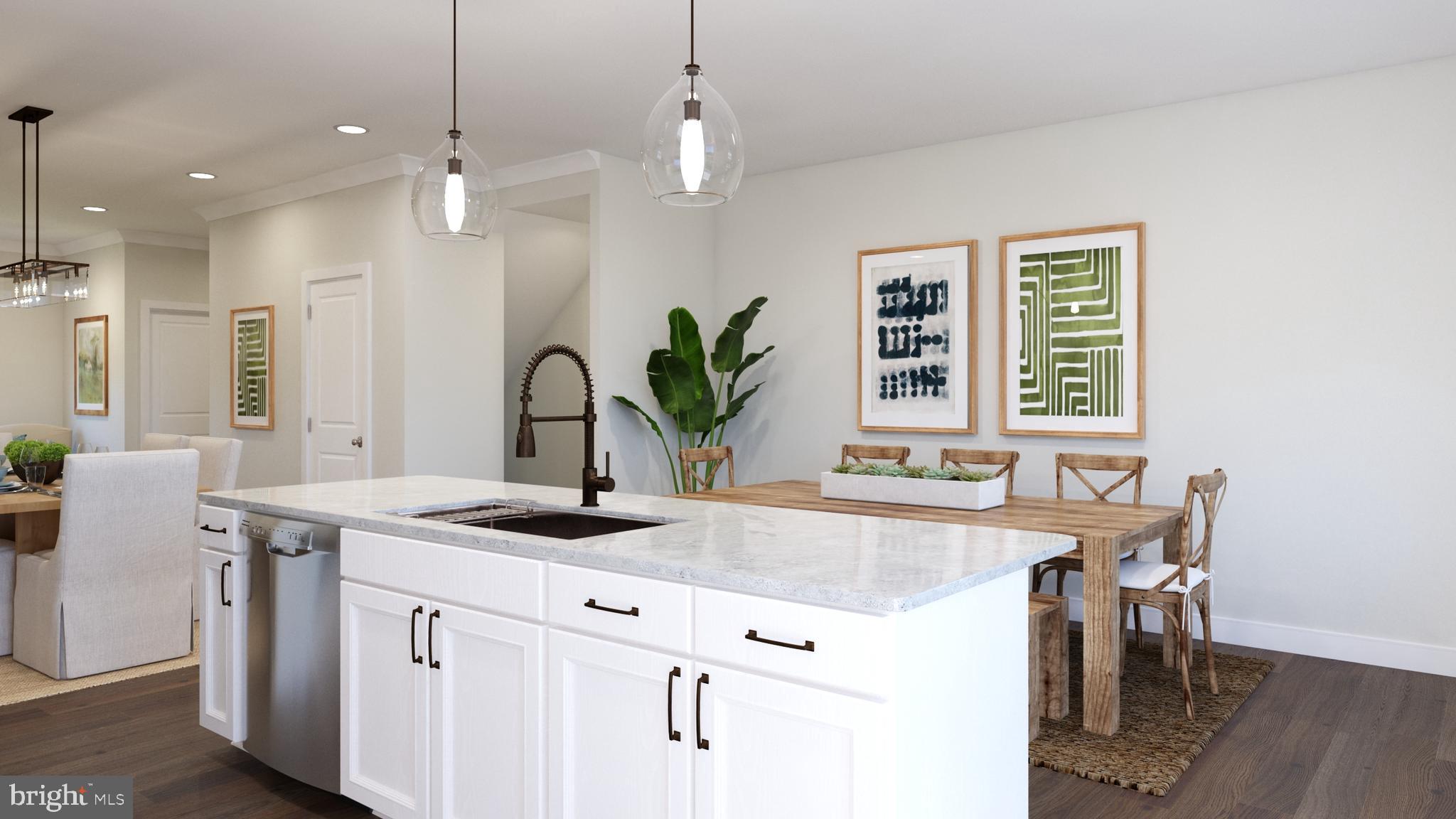 a kitchen with kitchen island granite countertop a sink a counter top space and cabinets