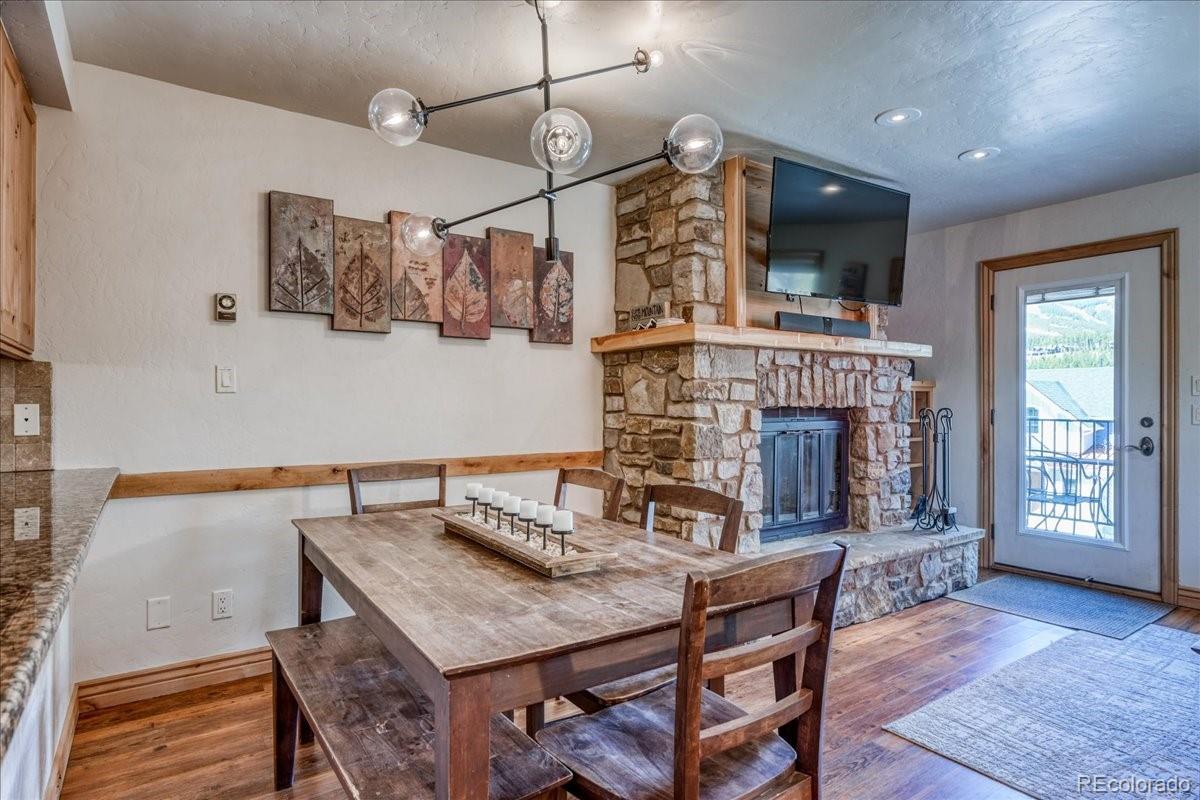 200 North Ridge Street, Unit R1 Breckenridge, CO 80424 - Photo 9 of 27 a living room with a table chairs and a fireplace