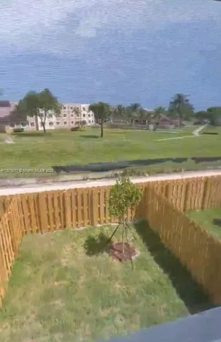 a view of a lake with a building in the background