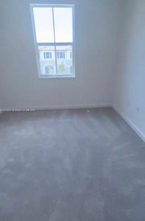12147 Northwest 23rd Court Miami, FL 33167 - Photo 16 of 19 an empty room with a window