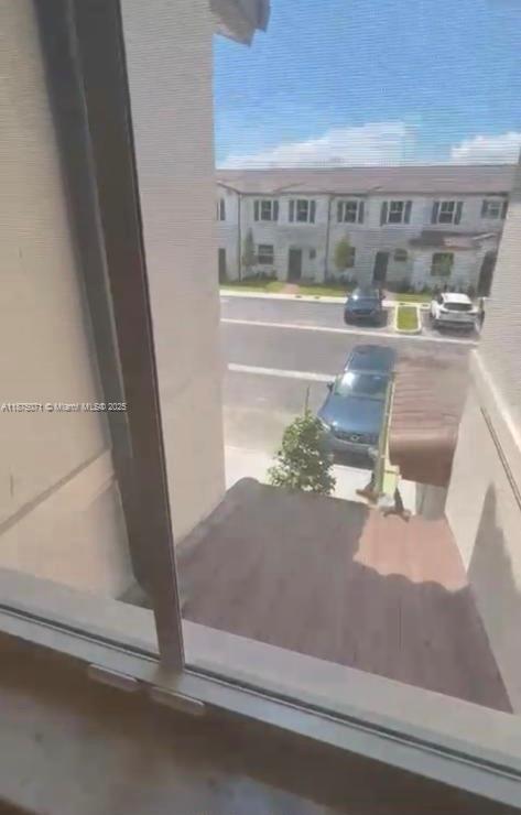 12147 Northwest 23rd Court Miami, FL 33167 - Photo 18 of 19 a room with balcony