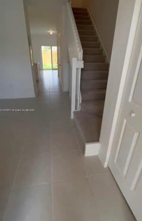 12147 Northwest 23rd Court Miami, FL 33167 - Photo 19 of 19 a view of entryway and hall with wooden floor