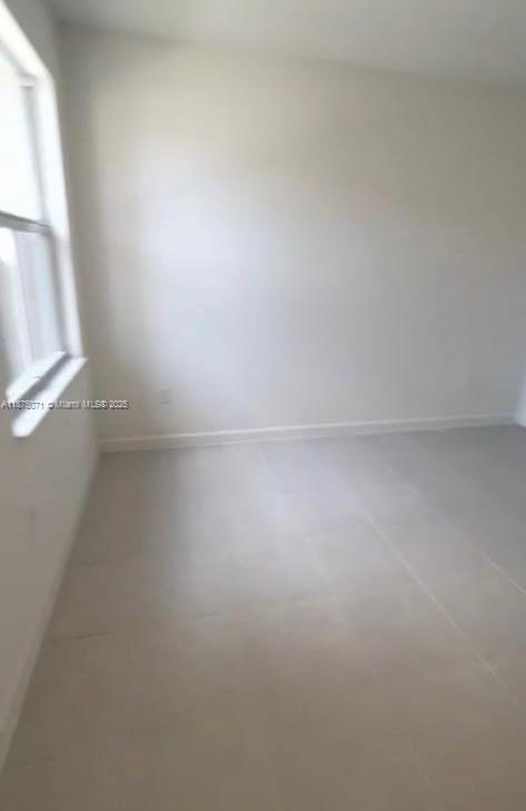 12147 Northwest 23rd Court Miami, FL 33167 - Photo 3 of 19 a view of room