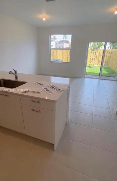 12147 Northwest 23rd Court Miami, FL 33167 - Photo 7 of 19 a utility room with a sink washer and dryer