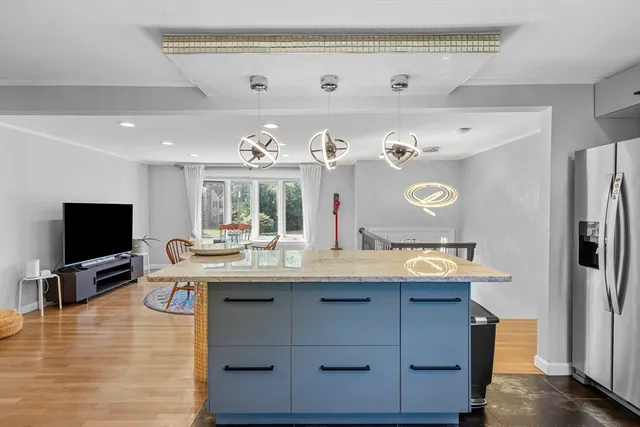 a view of kitchen island cabinets and wooden floor