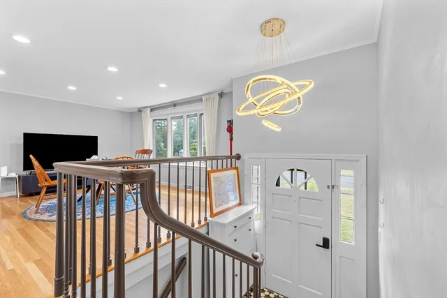 a view of an entryway with wooden floor