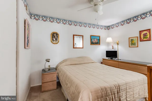 a bedroom with a bed and a table