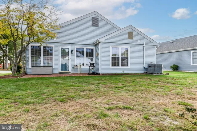 a front view of house with yard and porch