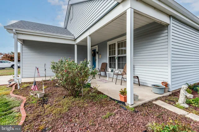 a view of a backyard with sitting area