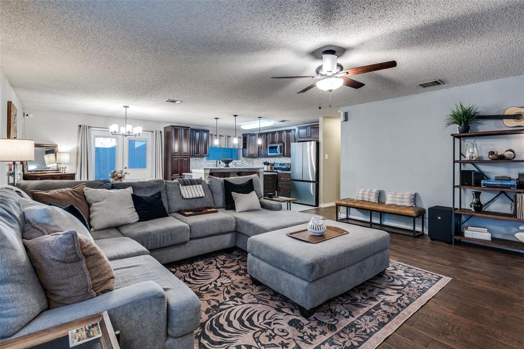 656 Condor Trail Saginaw, TX 76131 - Photo 5 of 25 a living room with furniture and a chandelier
