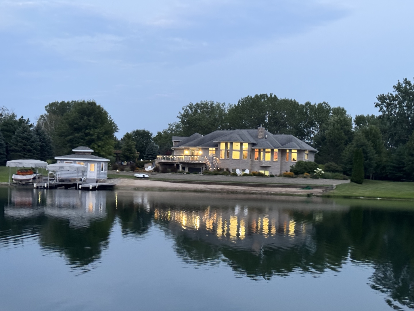 a view of swimming pool and lake from balcony