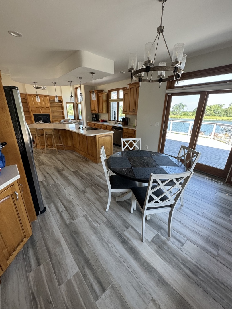 8726 East Goodfarm Road Gardner, IL 60424 - Photo 3 of 12 a view of a livingroom with furniture window and wooden floor