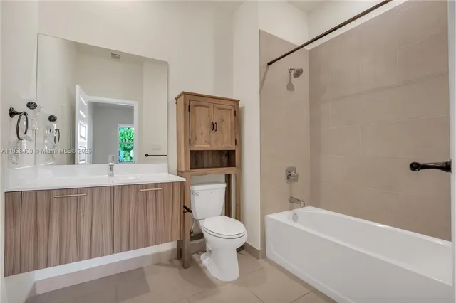 a bathroom with a toilet a sink and a bathtub
