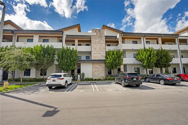 a view of a park with swings and slides