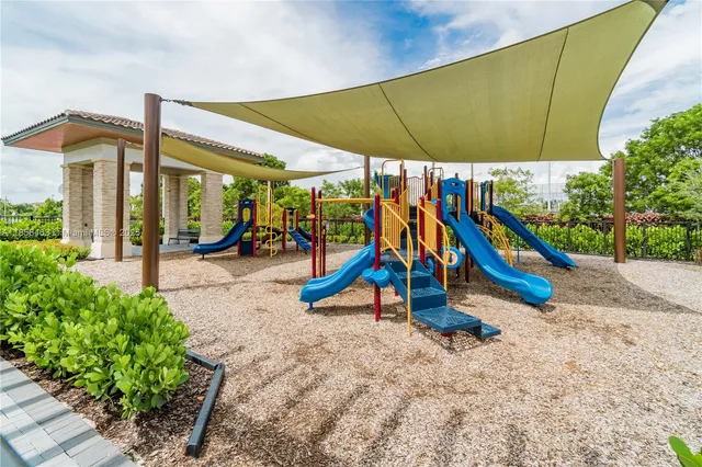 a view of a room with lots of wooden furniture