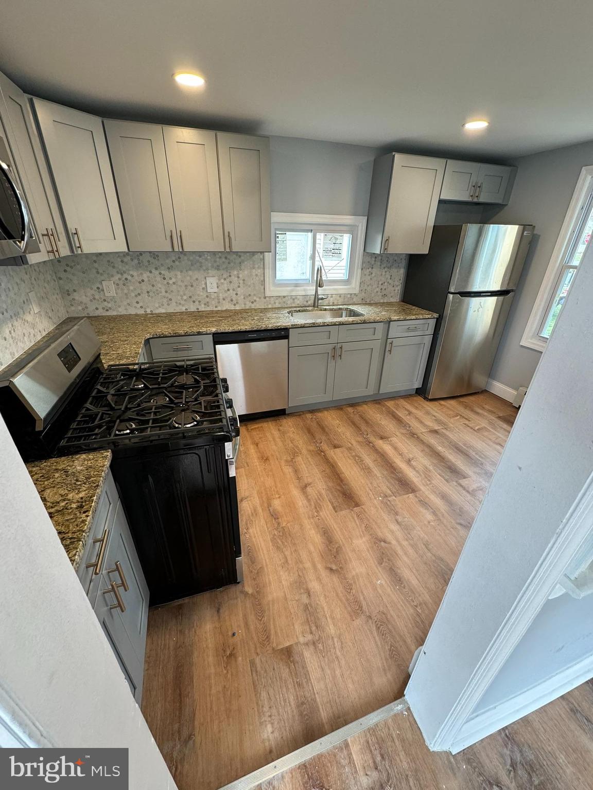 509 Laurel Street Beverly, NJ 08010 - Photo 13 of 47 a kitchen with a stove and a refrigerator