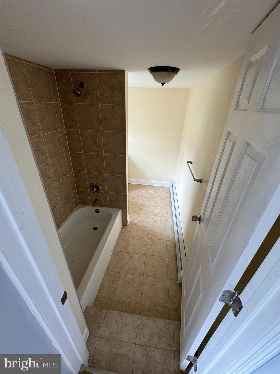 509 Laurel Street Beverly, NJ 08010 - Photo 17 of 47 a bathroom with a tub a sink and a shower