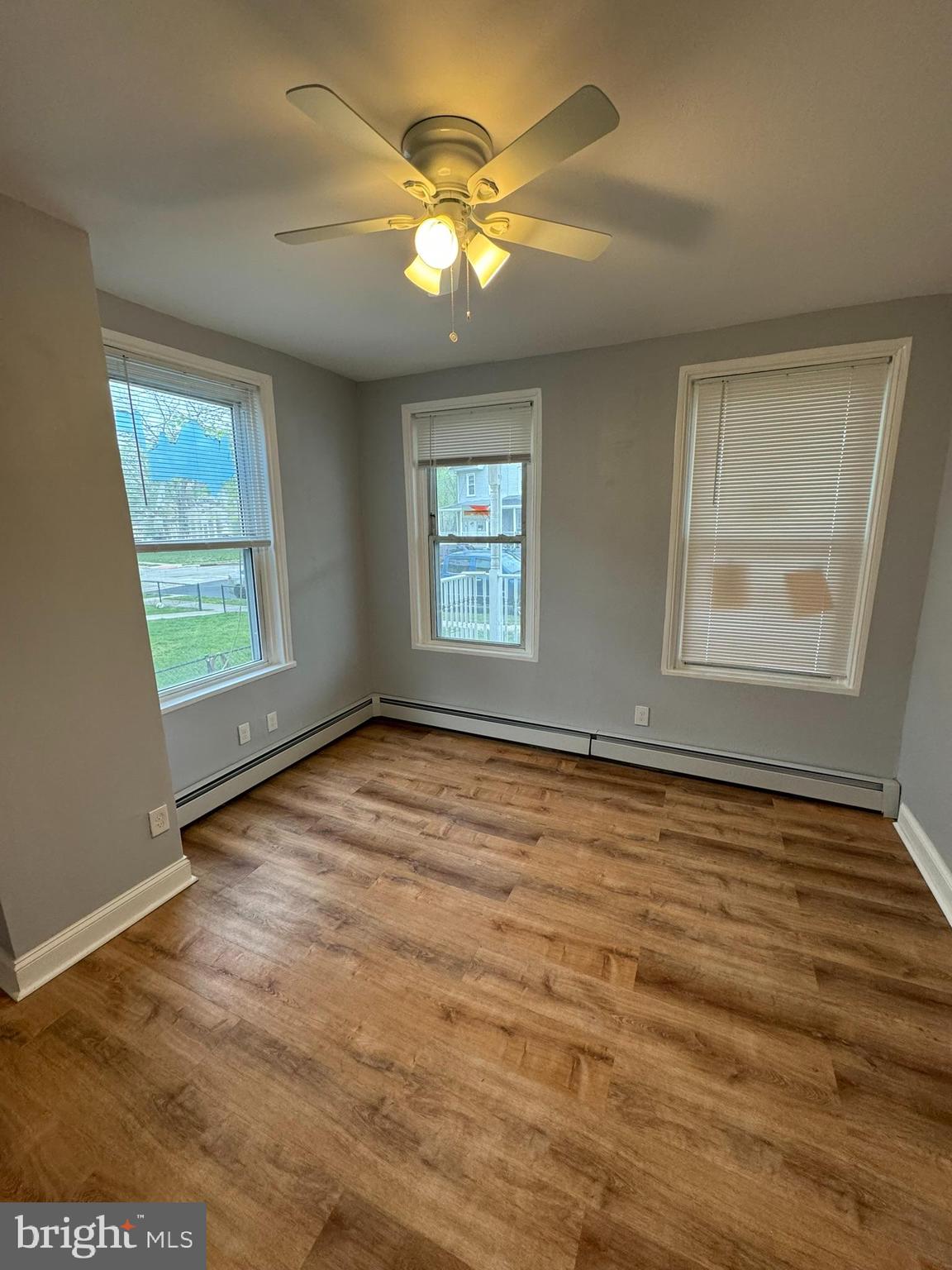 509 Laurel Street Beverly, NJ 08010 - Photo 23 of 47 a view of an empty room with window and wooden floor