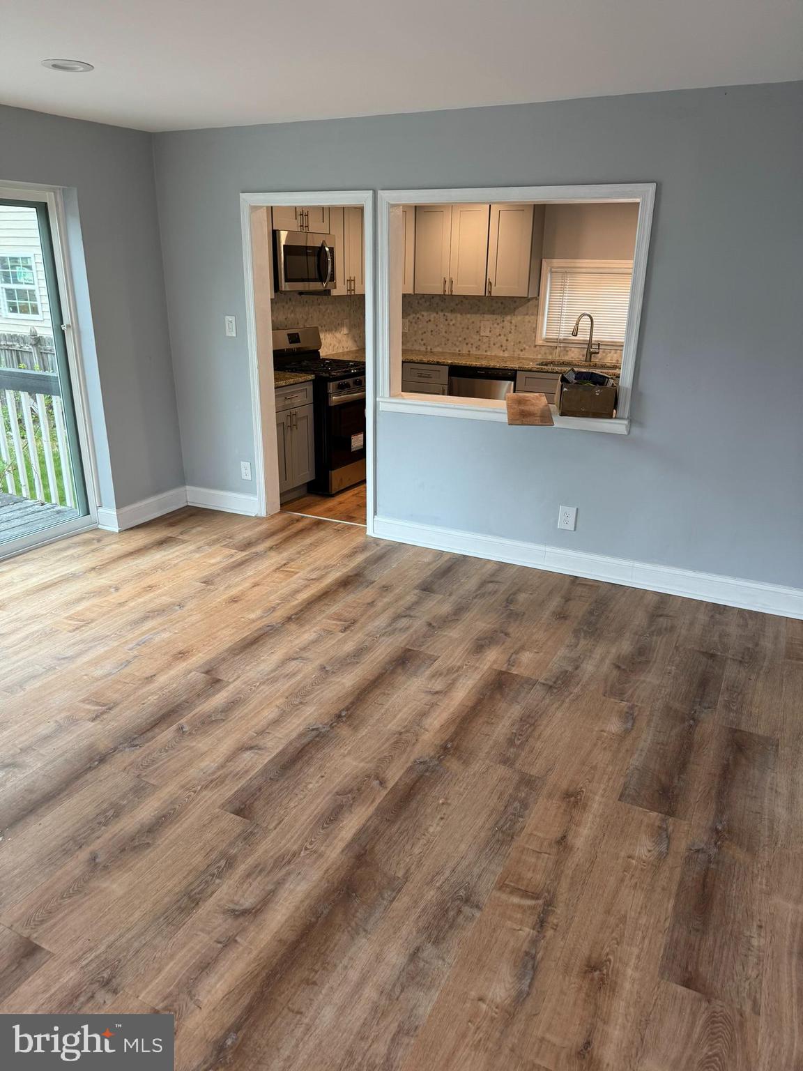 509 Laurel Street Beverly, NJ 08010 - Photo 26 of 47 a view of a kitchen with wooden cabinet and a window