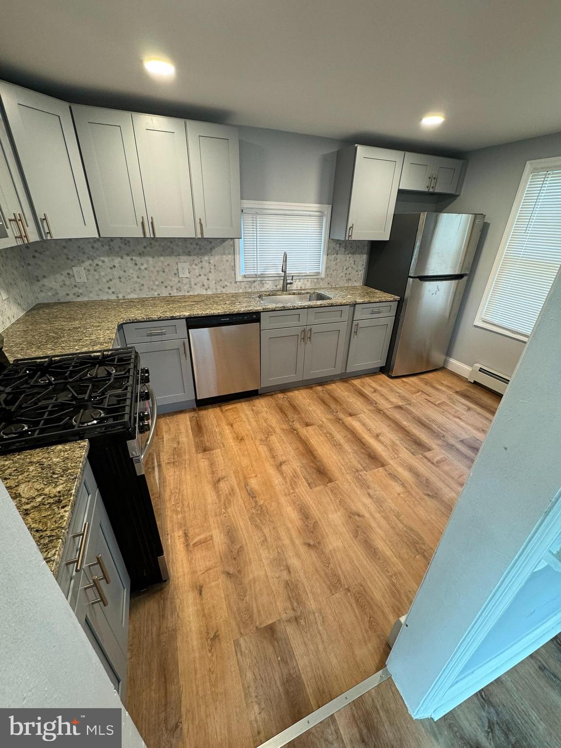 509 Laurel Street Beverly, NJ 08010 - Photo 28 of 47 a kitchen with granite countertop a sink a counter top space and cabinets