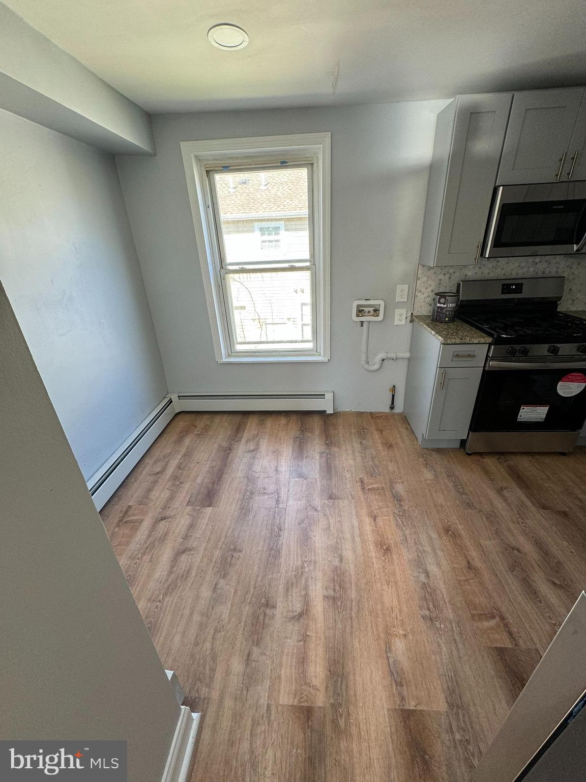 509 Laurel Street Beverly, NJ 08010 - Photo 38 of 47 a kitchen with wooden floors and a stove