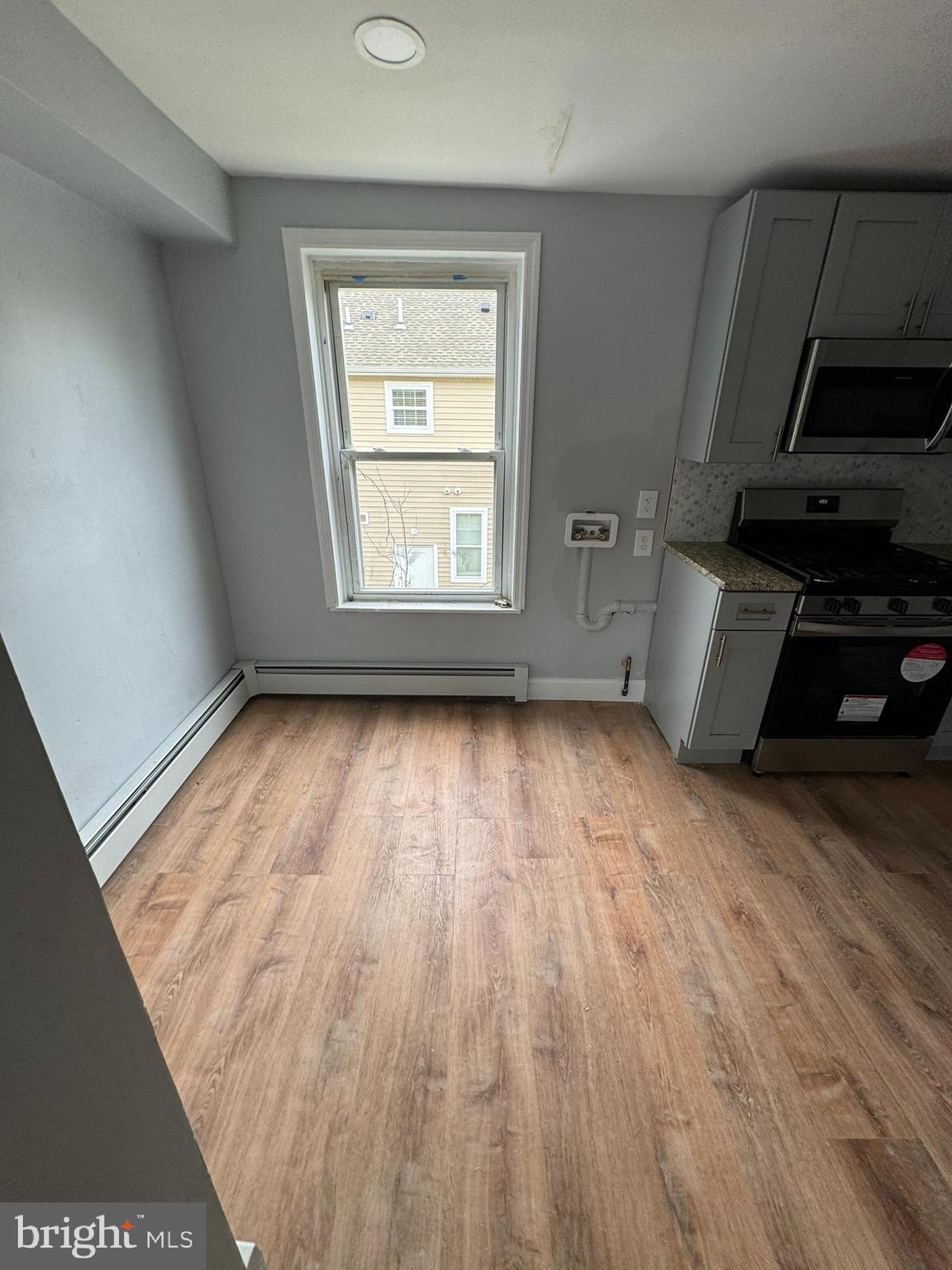 509 Laurel Street Beverly, NJ 08010 - Photo 47 of 47 a view of empty room with wooden floor and fan