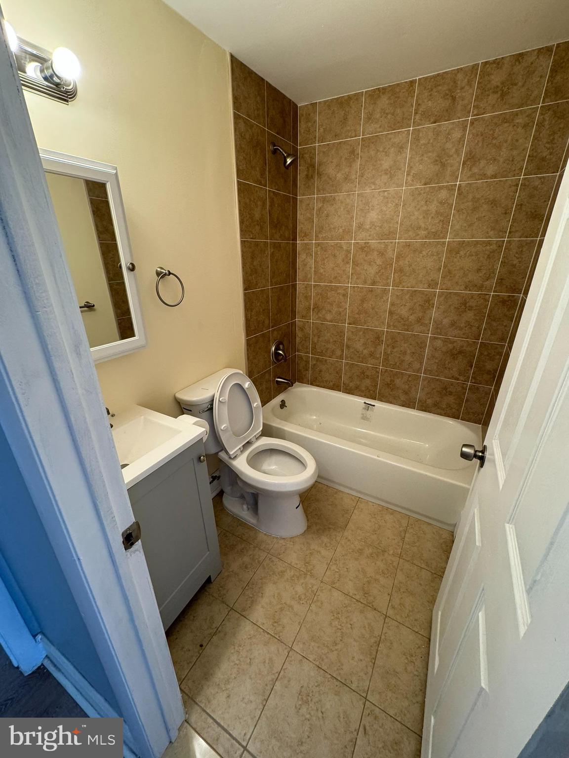 509 Laurel Street Beverly, NJ 08010 - Photo 5 of 47 a bathroom with a sink a toilet a mirror a vanity and shower