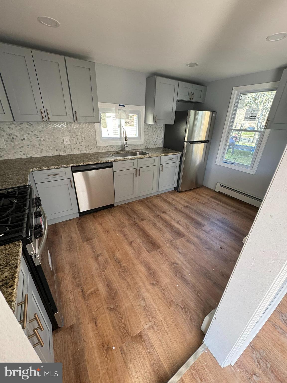 509 Laurel Street Beverly, NJ 08010 - Photo 10 of 47 a large bed sitting in a kitchen next to a window