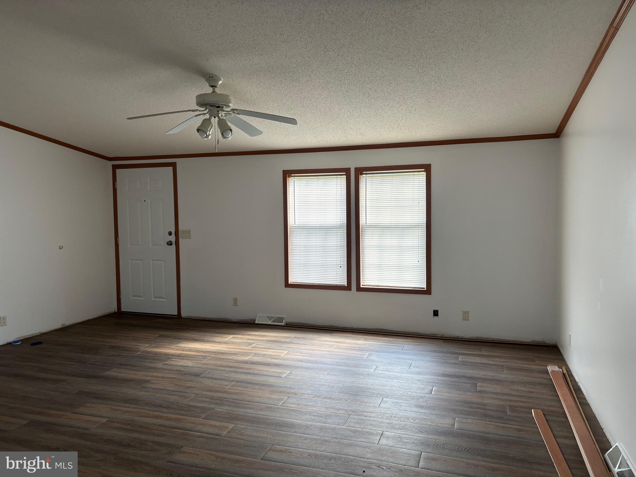 3825 Dickenson Mountain Road Franklin, WV 26807 - Photo 11 of 32 a view of an empty room with wooden floor and a window