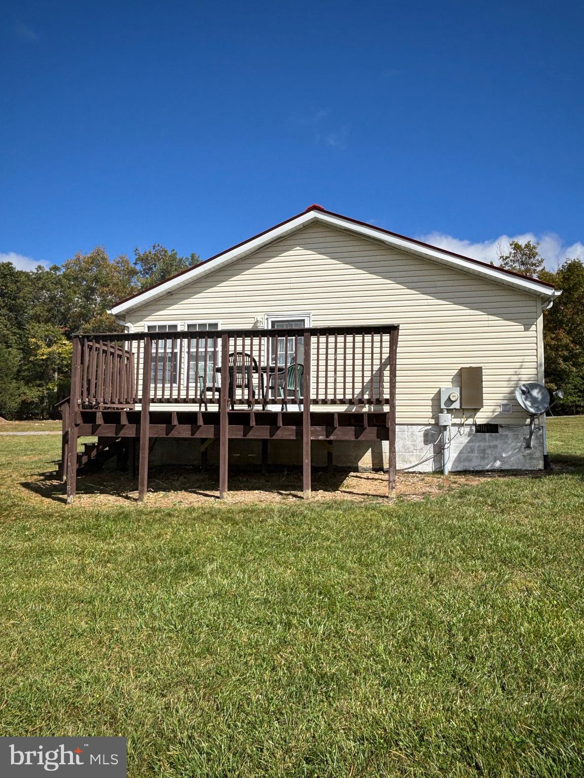 3825 Dickenson Mountain Road Franklin, WV 26807 - Photo 2 of 32 a view of a house with pool and chairs