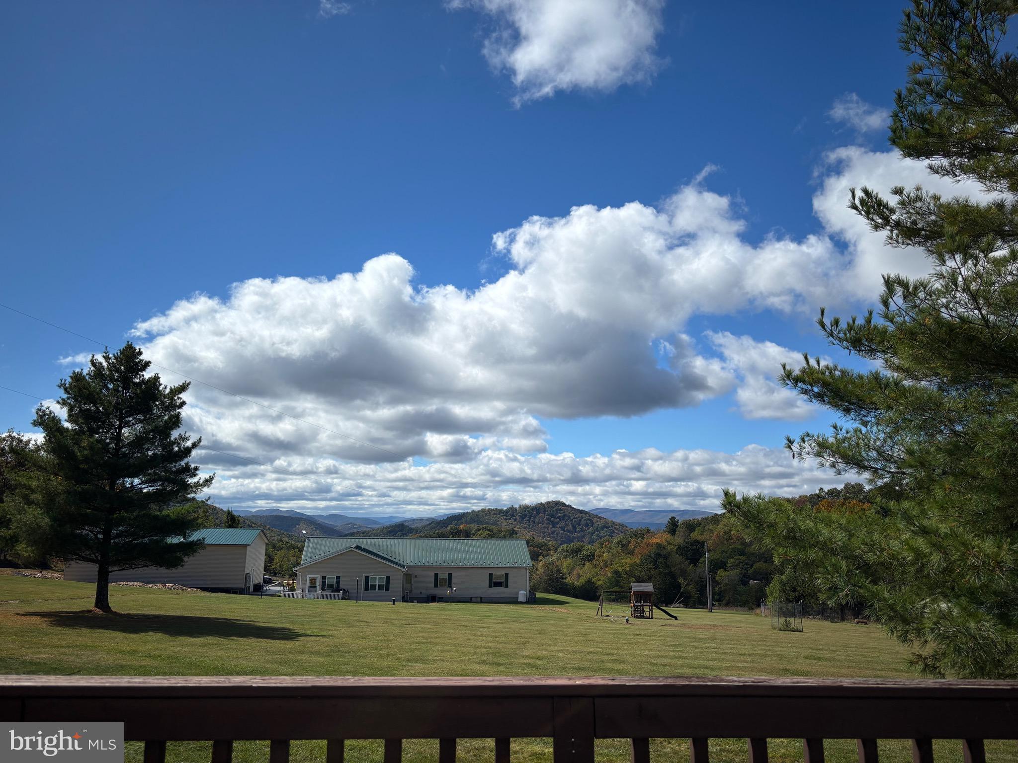 3825 Dickenson Mountain Road Franklin, WV 26807 - Photo 22 of 32 a view of a lake with a big yard