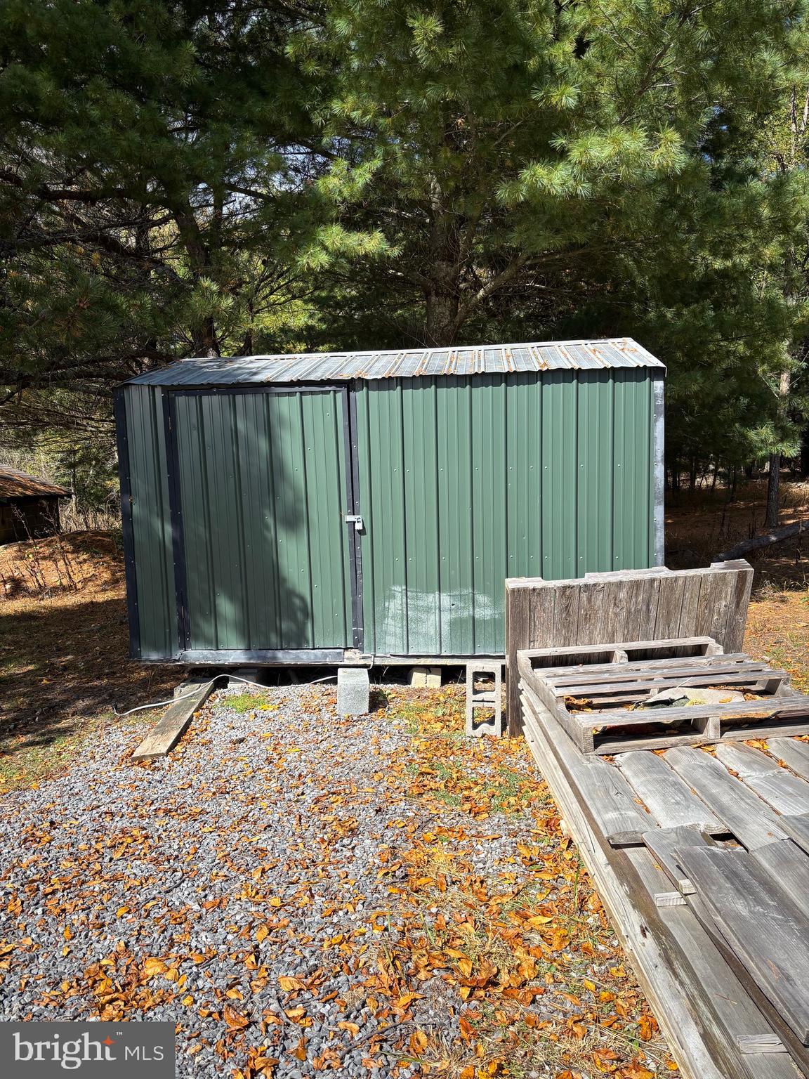 3825 Dickenson Mountain Road Franklin, WV 26807 - Photo 26 of 32 a view of a backyard with wooden fence and trees