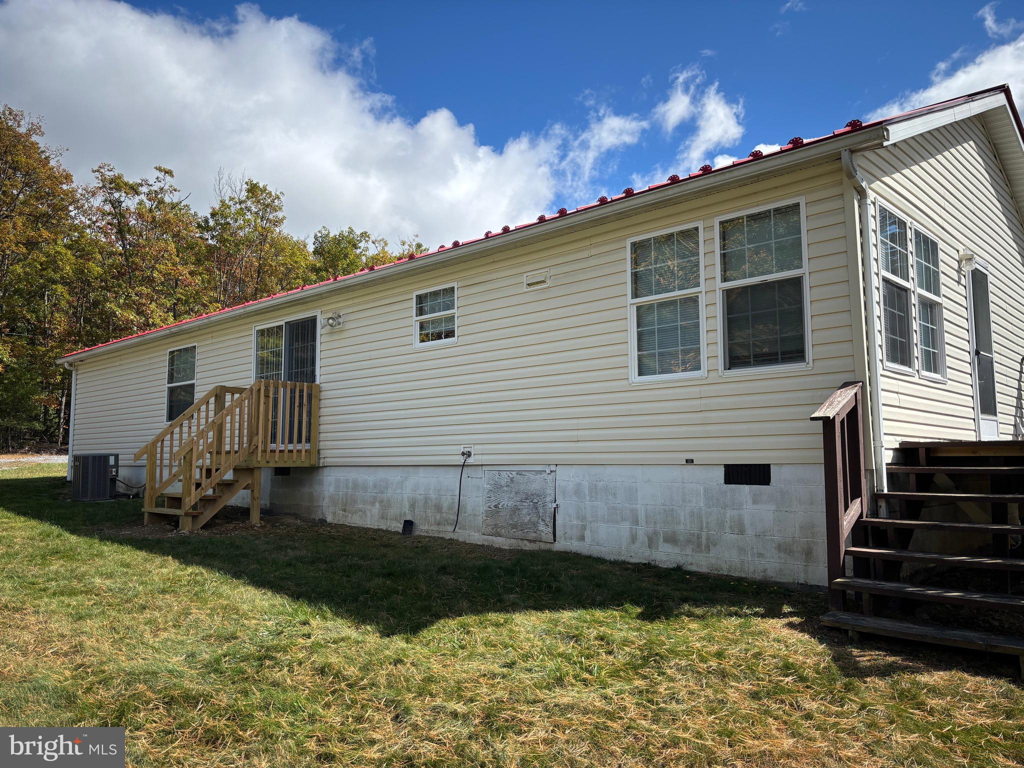 3825 Dickenson Mountain Road Franklin, WV 26807 - Photo 3 of 32 a view of a house with backyard and sitting area