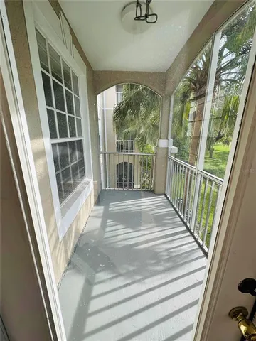a view of porch with wooden floor and windows
