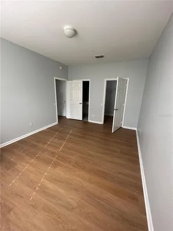 a view of a livingroom with wooden floor