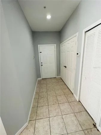 a view of a livingroom with an empty space and a window