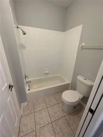 a view of bathroom and shower