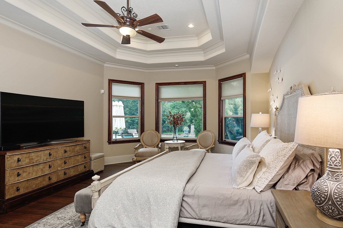 119 Angel Leaf Road The Woodlands, TX 77380 - Photo 27 of 50 a bedroom with a bed and a flat screen tv