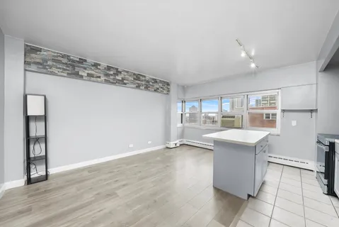 a view of kitchen with furniture and wooden floor