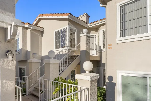a view of a house with wooden deck