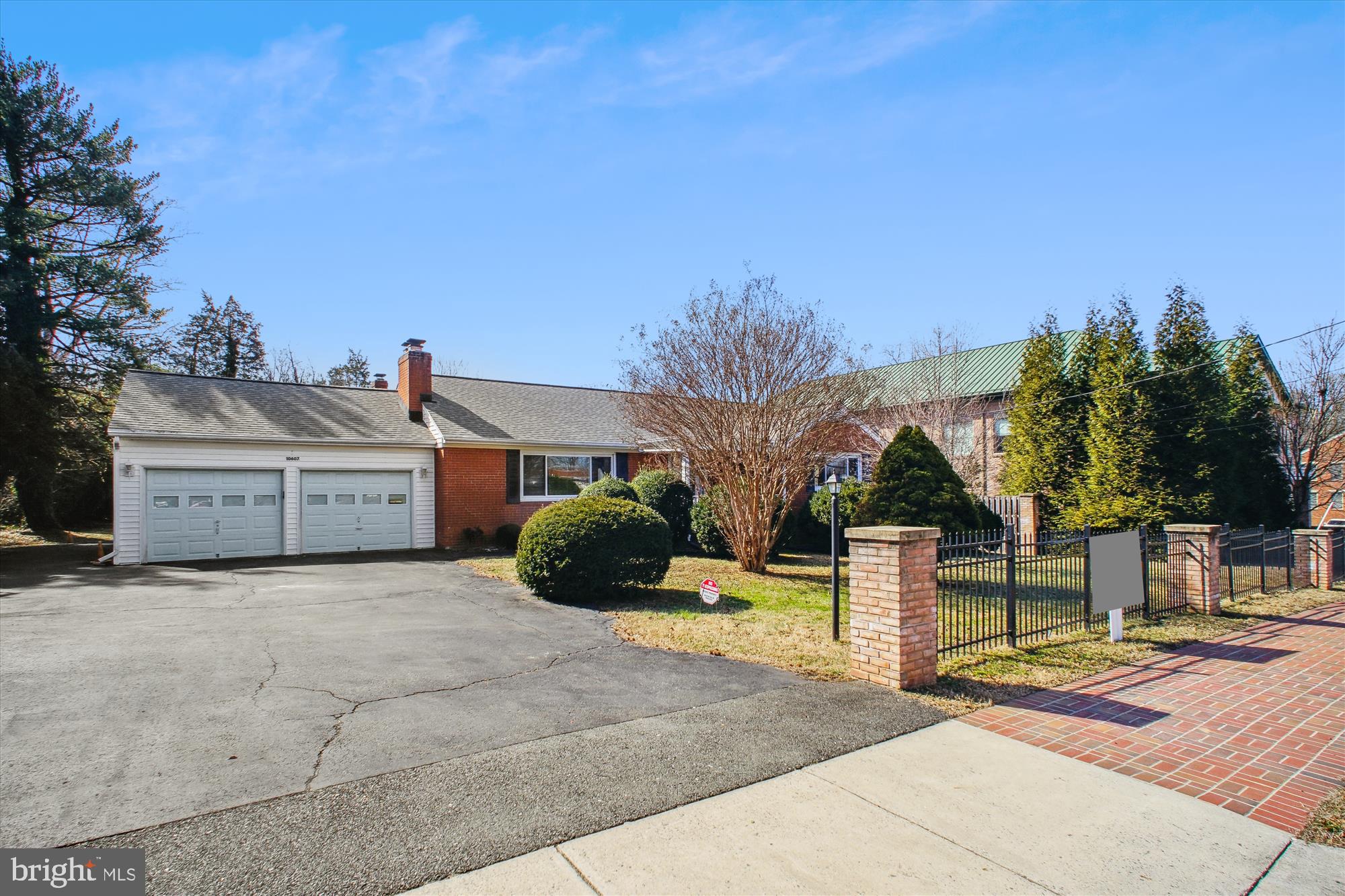 10607 Judicial Drive Fairfax, VA 22030 - Photo 1 of 60 a view of a house with backyard and a tree