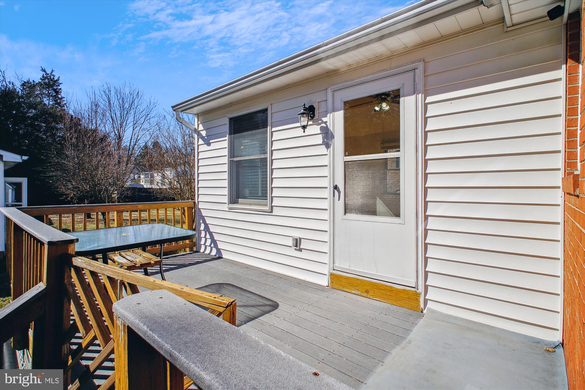 10607 Judicial Drive Fairfax, VA 22030 - Photo 18 of 60 a view of a patio with table and chairs with wooden floor and fence