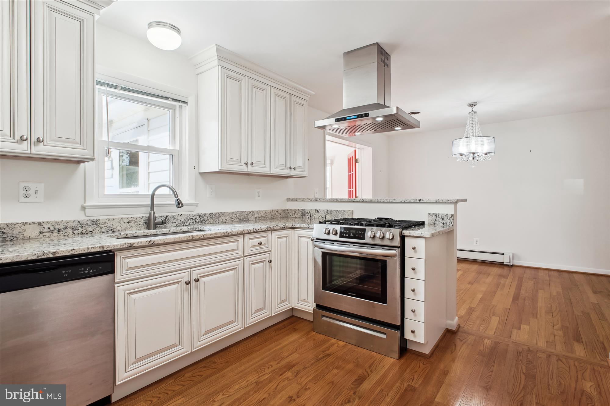 10607 Judicial Drive Fairfax, VA 22030 - Photo 21 of 60 a kitchen with stainless steel appliances granite countertop a stove and a sink