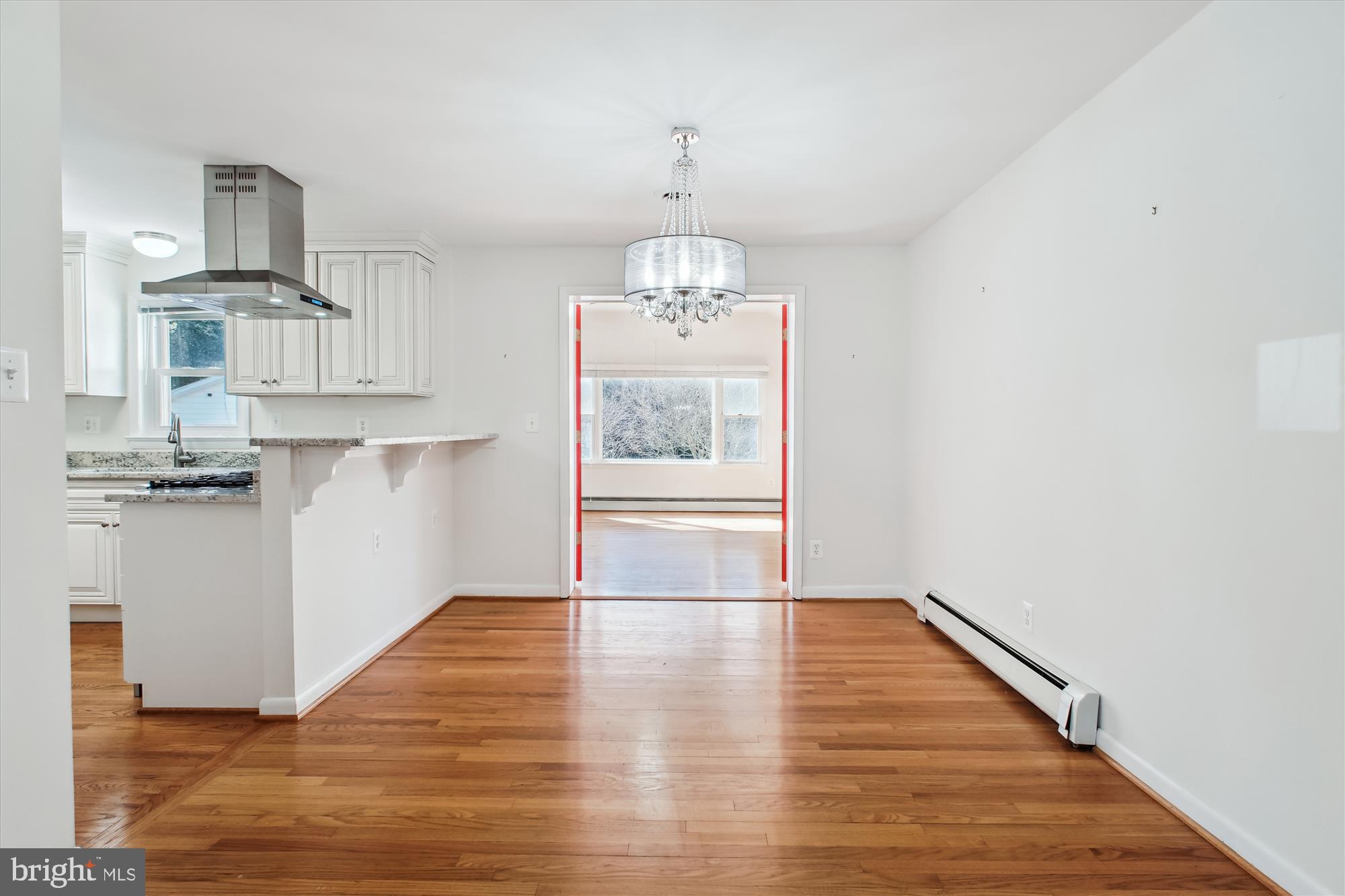 10607 Judicial Drive Fairfax, VA 22030 - Photo 23 of 60 a view of a kitchen with wooden floor electronic appliances and window