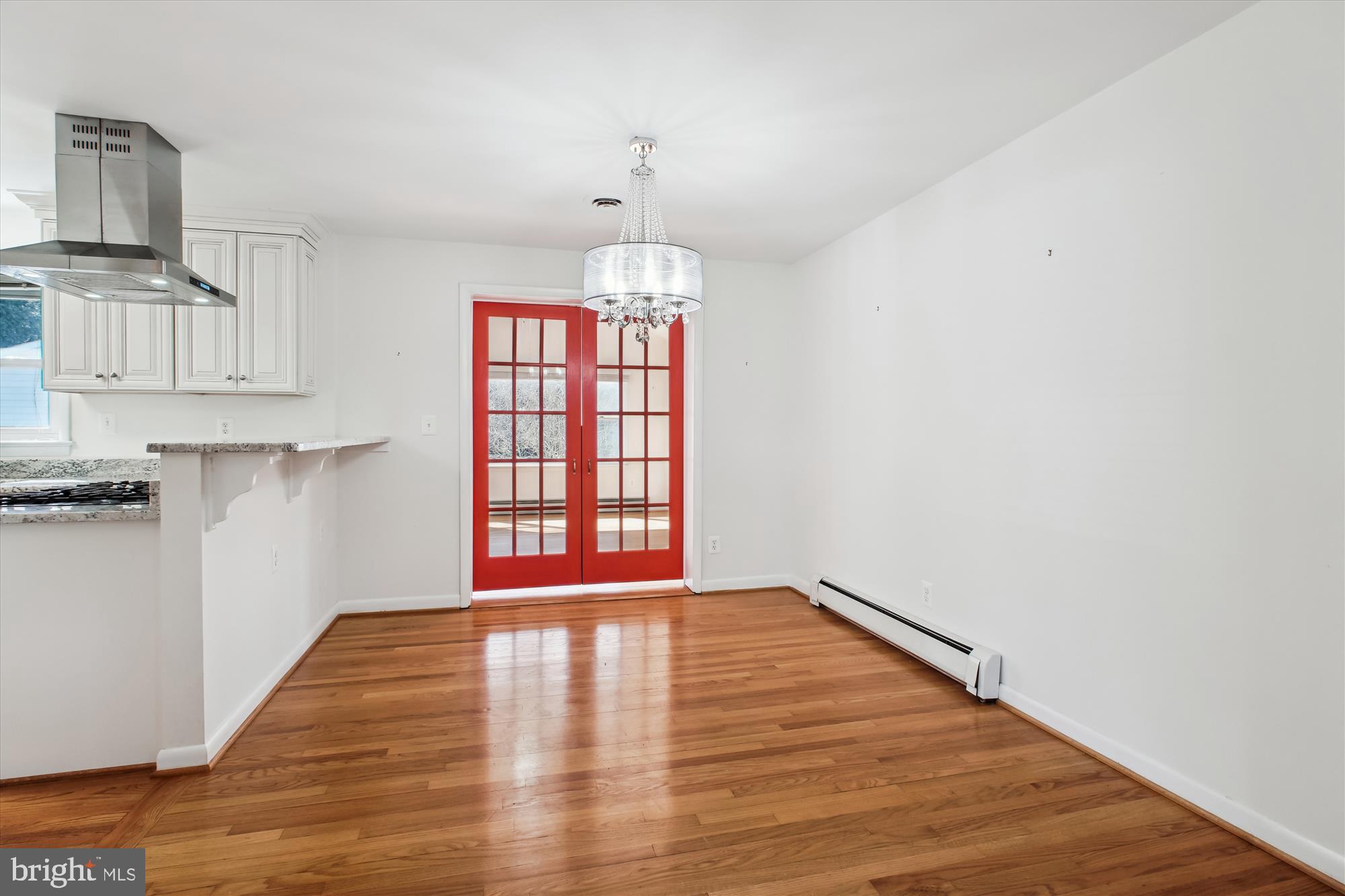 10607 Judicial Drive Fairfax, VA 22030 - Photo 25 of 60 a view of an empty room with wooden floor and a window