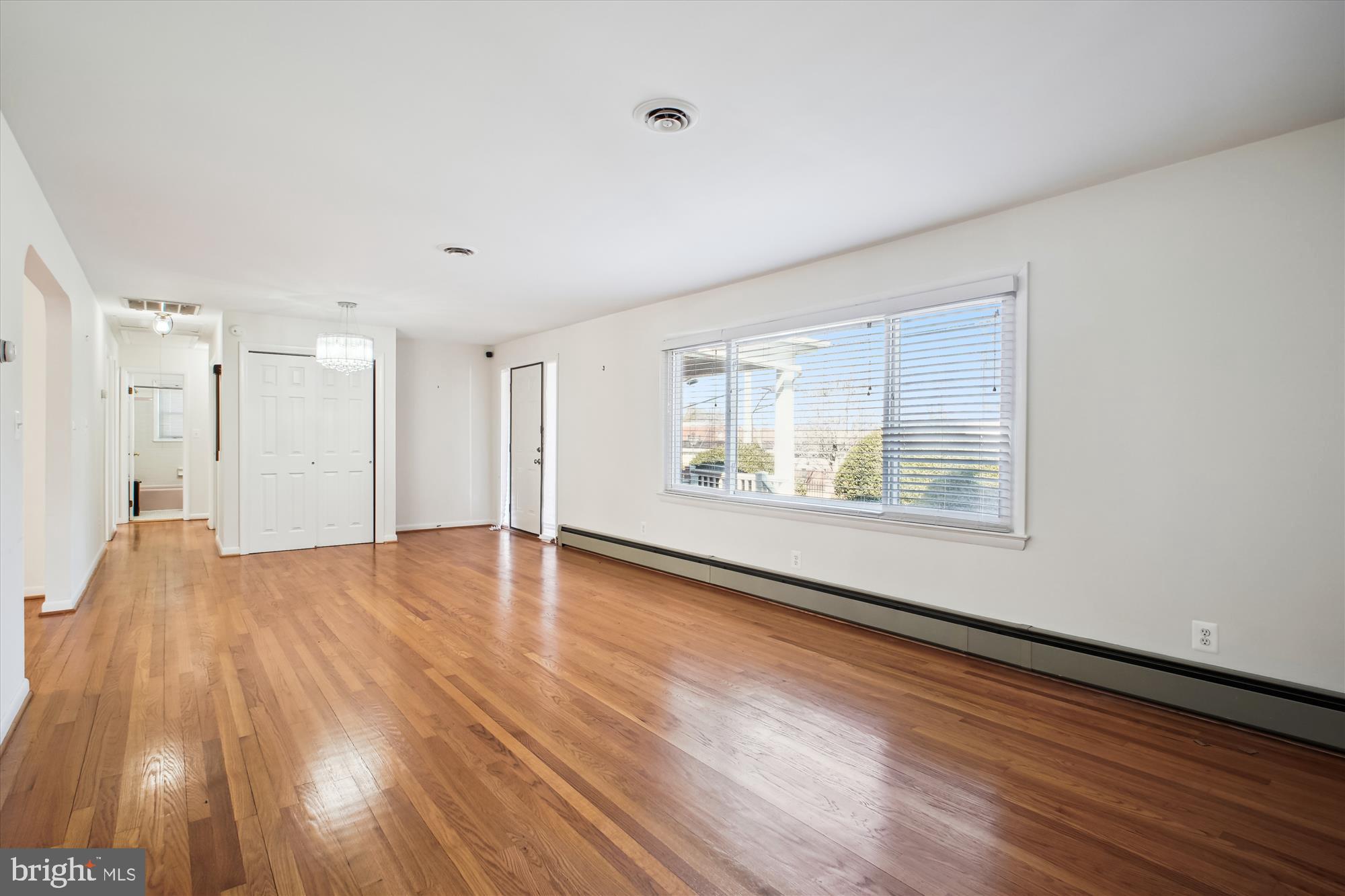 10607 Judicial Drive Fairfax, VA 22030 - Photo 28 of 60 a view of an empty room with wooden floor and a window