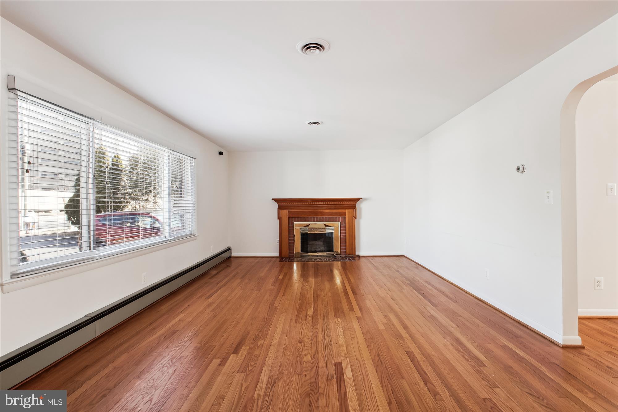 10607 Judicial Drive Fairfax, VA 22030 - Photo 29 of 60 a view of an empty room with wooden floor and a window
