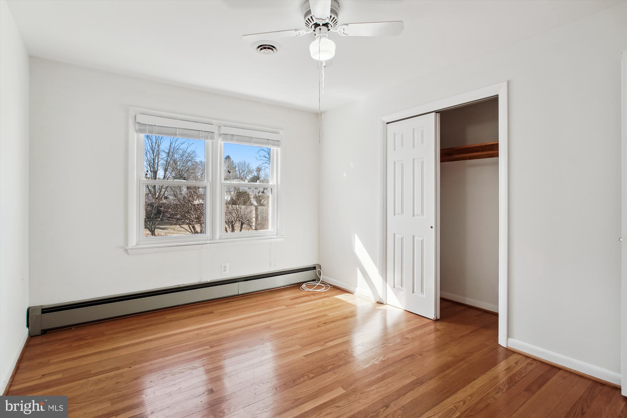 10607 Judicial Drive Fairfax, VA 22030 - Photo 44 of 60 a view of an empty room with wooden floor and a window