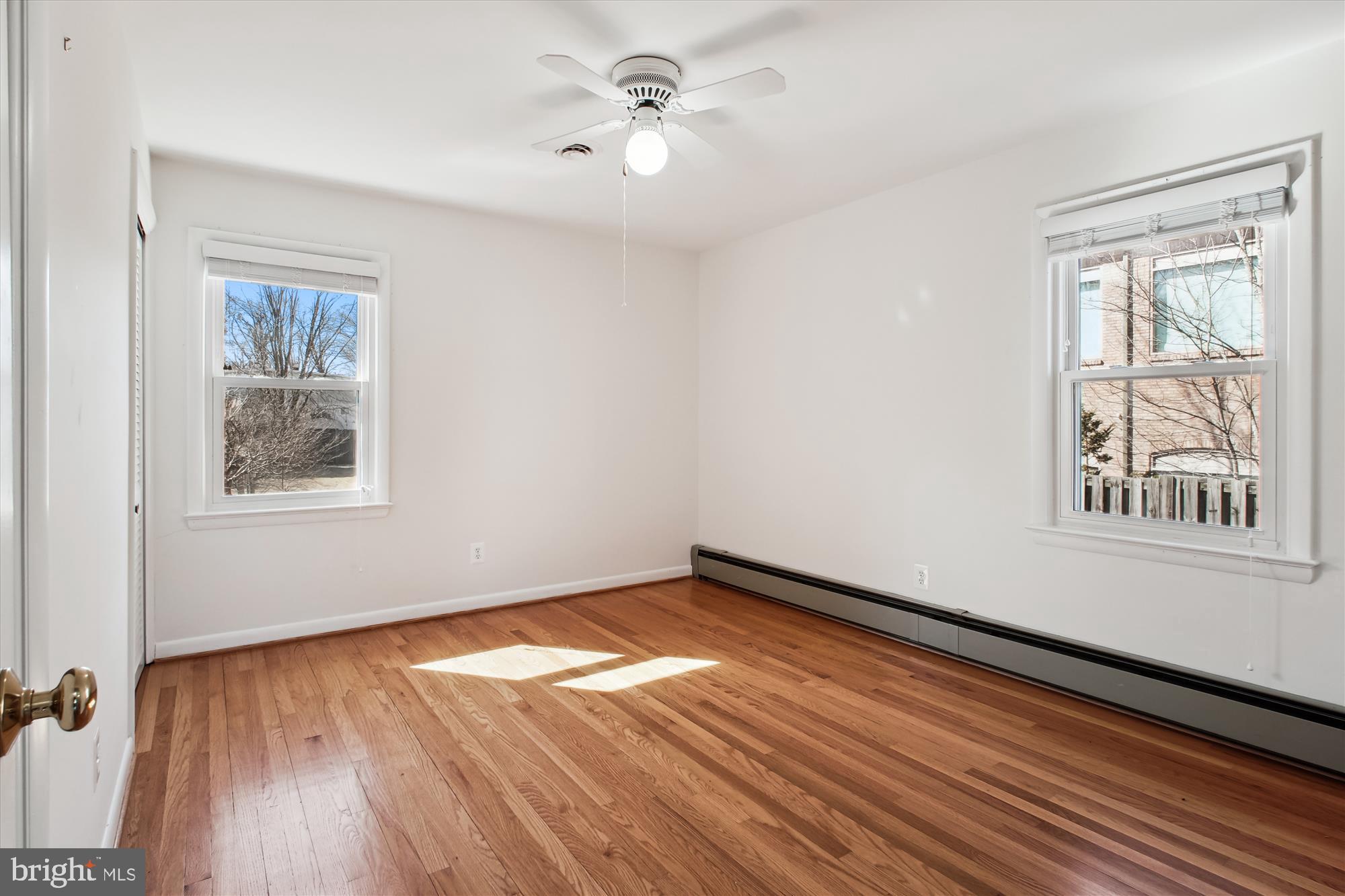 10607 Judicial Drive Fairfax, VA 22030 - Photo 45 of 60 a view of empty room with wooden floor and fan